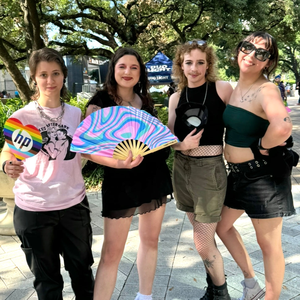 Trans women holding Psychedelic Trans Fan (UV) | hand fan for Transgender Pride | The Gay Fan Club 